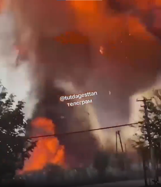 Large fire near trees.