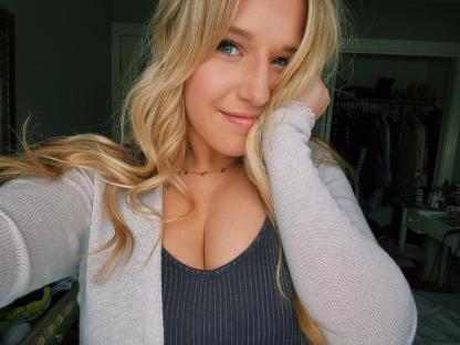 Self-portrait of a young woman with blonde hair.