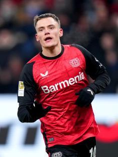 Florian Wirtz of Bayer 04 Leverkusen celebrating a goal.