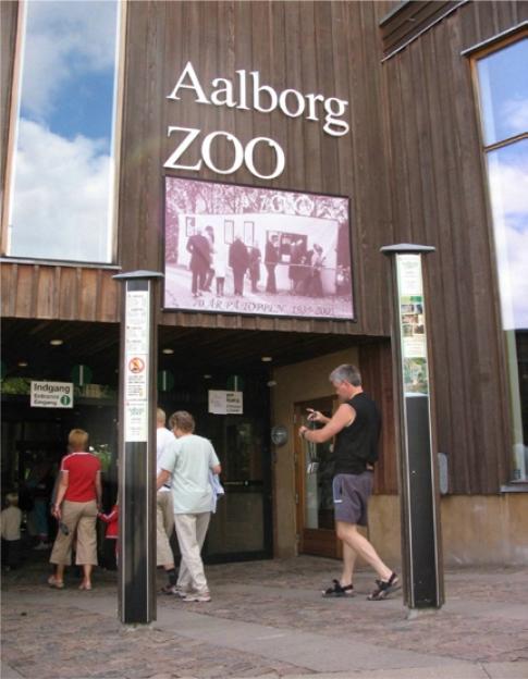 Aalborg Zoo entrance with visitors.