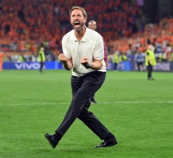 DORTMUND, GERMANY - JULY 10: England head coach Gareth Southgate celebrates victory with the fans after the UEFA EURO 2024 semi-final match between Netherlands and England at Football Stadium Dortmund on July 10, 2024 in Dortmund, Germany. (Photo by Stu Forster/Getty Images)