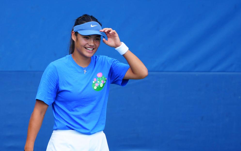 Emma Raducanu smiling during a tennis practice.