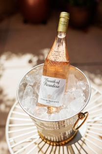 Bottle of Breath of Paradise rosé wine in an ice bucket.