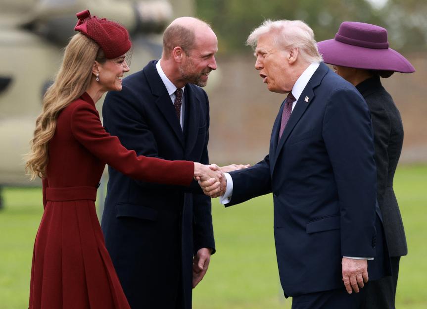 US President Donald Trump shakes hands with Prince William while Catherine, Princess of Wales, also shakes hands with Trump, and First Lady Melania Trump stands behind him, at Windsor Castle.