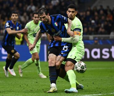 Francesco Acerbi of FC Internazionale Milano scoring a goal during a UEFA Champions League match.