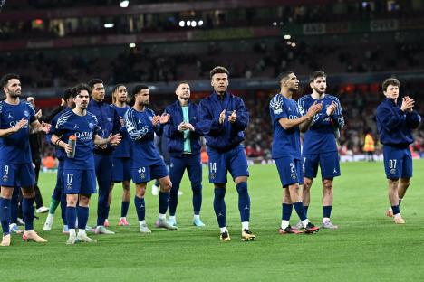 PSG players applaud after a UEFA Champions League match.