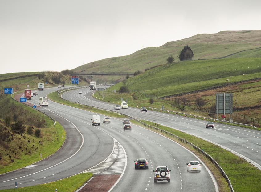 Traffic on the M6 motorway in the rain.