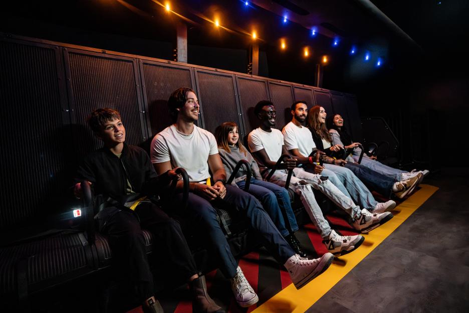 People enjoying a Niagara Falls flight simulation ride.