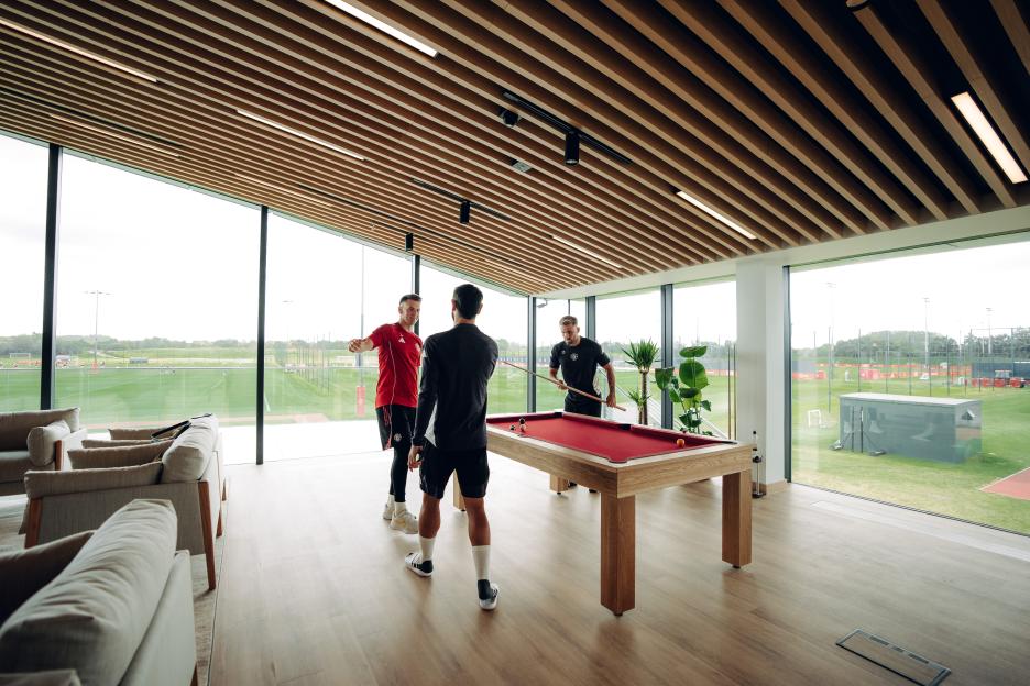 Manchester United players playing pool.
