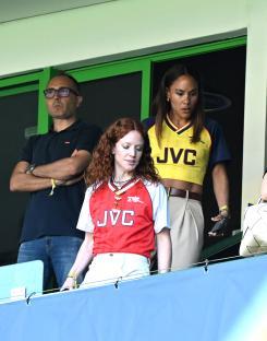 Jess Glynne and Alex Scott at a soccer match.