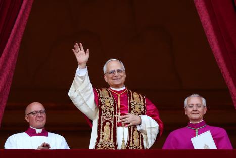 Newly elected Pope Leo XIV waving from a balcony.