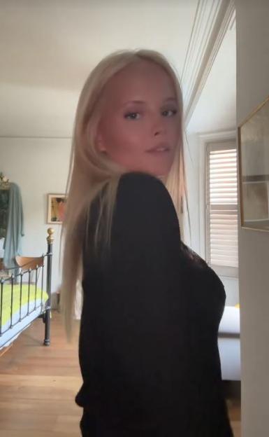 Mary Glen in a black top, looking over her shoulder.