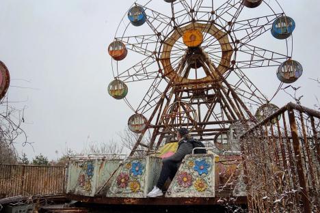 Inside haunting theme park left abandoned for 18 years with empty stadium and decaying Ferris wheel