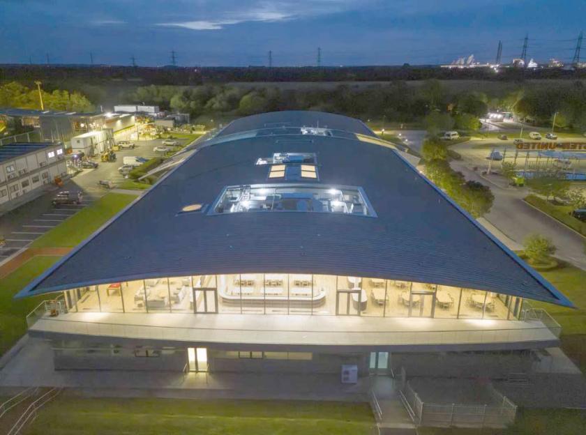 Aerial view of the refurbished Carrington Manchester United training ground at night.