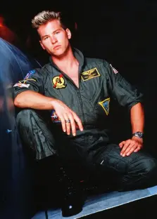 Tom Cruise in a Top Gun flight suit.