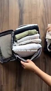 Packing three months' worth of clothing into a carry-on suitcase.