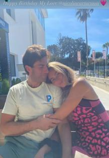 James Argent and his girlfriend Nicole hugging on a bench.