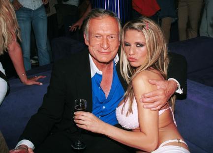 Hugh Hefner with a Playmate at The Standard Hotel.