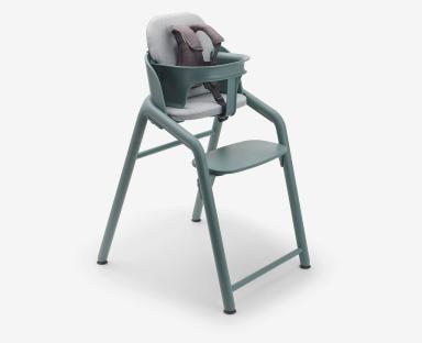 Teal Bugaboo highchair with safety harness.