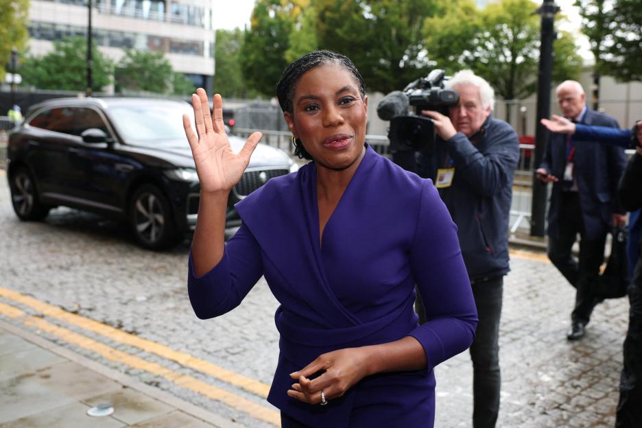 Britain's Conservative Party Leader Kemi Badenoch waves to the camera.