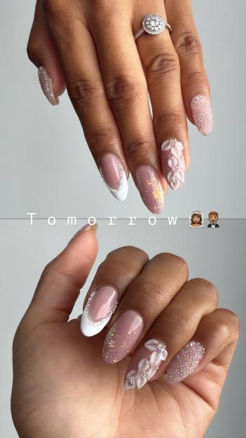 Wedding-themed nails with a diamond ring.