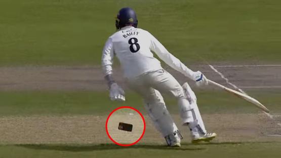 ‘I wonder if that’s has to be reported’ – Moment cricketer drops his PHONE while taking a run leaves commentator stunned
