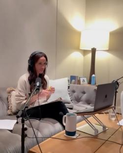 Meghan Markle recording a podcast.