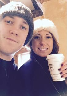 Chris Stark and his wife Ria holding a coffee cup.