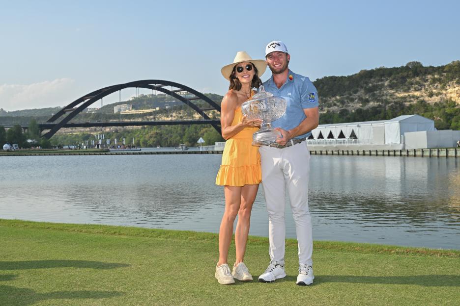 Sam Burns and his wife, Caroline Burns, hold the trophy together at the WGC-Dell Match Play.