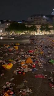 Litter and trash covering Trafalgar Square after a Sunderland fans' celebration.
