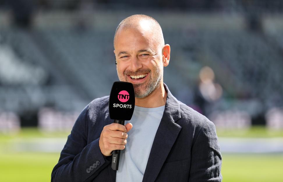 Joe Cole holding a TNT Sports microphone.