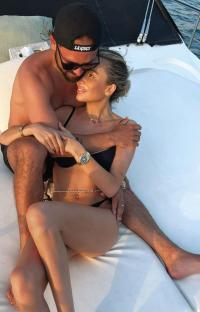 Olivia Attwood and Bradley Dack cuddling on a boat.