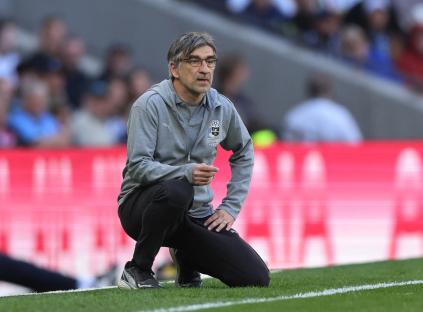 Southampton manager Ivan Juric kneeling on the field.