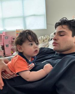 A man holding his baby.