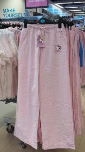 Pink Hello Kitty pants on display in a store.