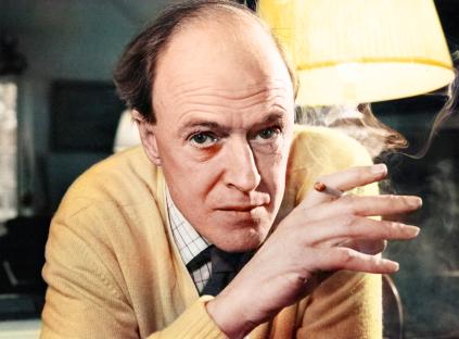 Photo of Roald Dahl smoking a cigarette.