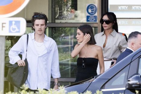 The Beckham family arriving at an airport.
