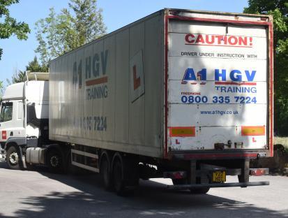 A1 HGV training lorry with driver under instruction.