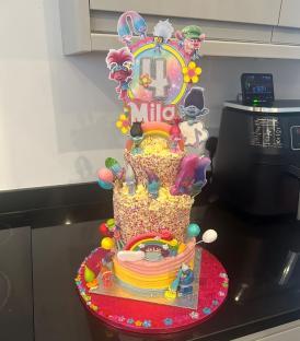 Two-tiered Trolls-themed birthday cake for Mila's 4th birthday.