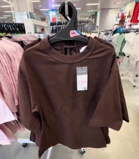 Brown cinch-waist T-shirt on display in Primark.