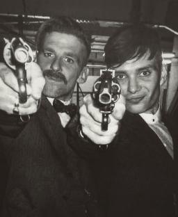 Black and white photo of Cillian Murphy and Paul Anderson on the set of Peaky Blinders.