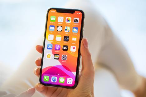 Woman holding iPhone 11 Pro.