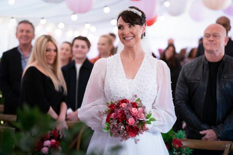 Honey Mitchell in a wedding dress at her wedding.