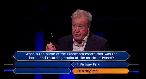 Screenshot of a game show question: What is the name of the Minnesota estate that was the home and recording studio of the musician Prince? The options are Fenway Park and Paisley Park.