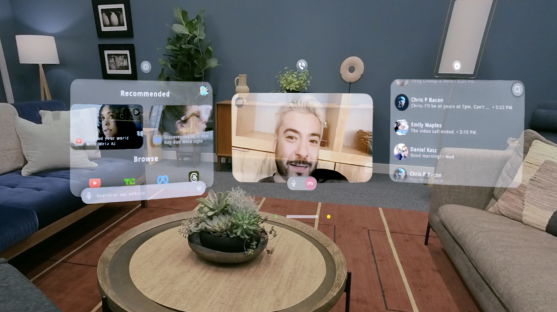 Holographic interface showing video calls and recommended content in a living room.