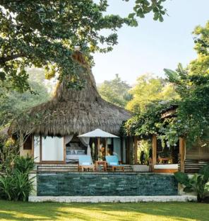 Luxury villa with private pool in tropical setting.