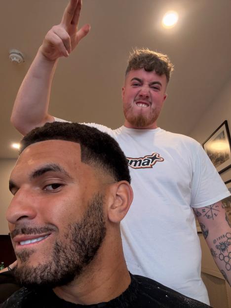 A man getting his hair cut.
