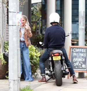 Helen Skelton and Gethin Jones on a motorbike.