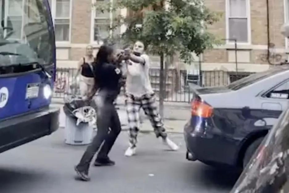 Brutal street brawl erupts after women try to claim parking spot by standing in the way of driver – who’s in the wrong?