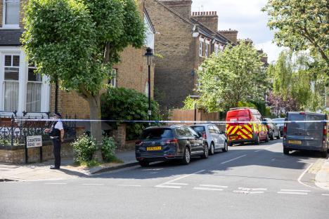 Police and emergency services outside a home.